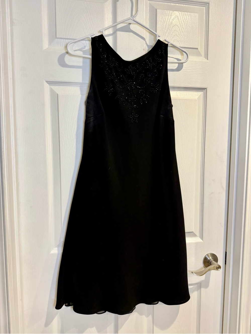 Classic Black Sleeveless Dress with bead detail and draped back